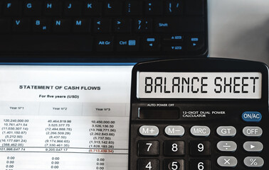 BALANCE SHEET - concept of text on calculator display. Top view