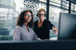 © Jacob Lund - Businesswomen cooperating working in a call center