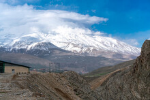 Clouds Gather Near The Summit Of Mt. Damavand, The Highest Stratovolcano In Asia. Partly Cloudy Afternoon In The Mountains Of Iran.