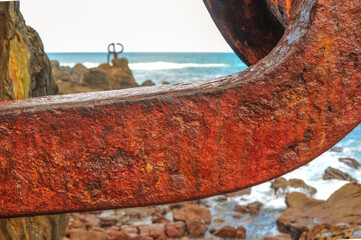 piece of rusty iron on the shore