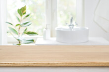 Bathroom Sink Near Window With Wooden Table In Front Focus