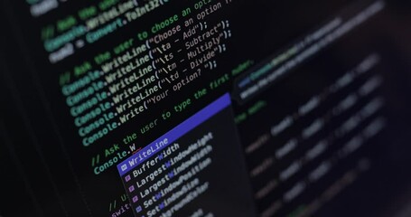 Text on laptop screen. The programmer writes the code.coding program programming developer compute web development work design software closeup desk write workstation key password theft hacking.