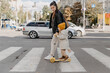 © Ananass - mother brings a child riding a scooter on the crosswalk