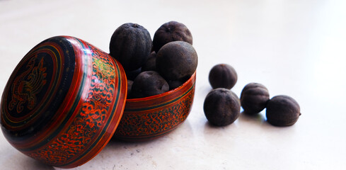 Black lime in ancient persian bowl