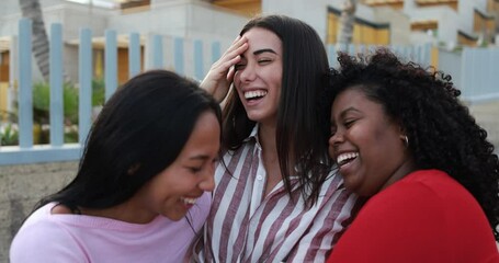 Wall Mural - Happy latin girls enjoy time together outdoor in the city - Vacation, weekend, happiness and friendship concept