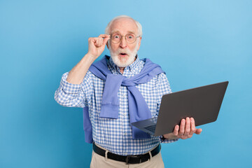 Sticker - Photo of impressed old grey hairdo man hold laptop wear spectacles blue shirt isolated on pastel color background