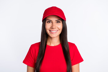 Poster - Photo of young happy cheerful smiling service worker delivery girl wear red t-shirt and cap isolated on grey color background