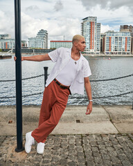 male fashion model posing in city