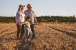 © BalanceFormCreative - Grandparents with they grandson.They playing on meadow and joying in sunset.