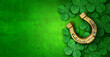 Saint Patricks Day lucky charms as green shamrock and a horse shoe as a clover leaf background as a St Patrick celebration symbol and seasonal spring icon of Irish tradition celebration
