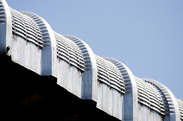 Sticker - Low angle shot of curved metal sheet roof