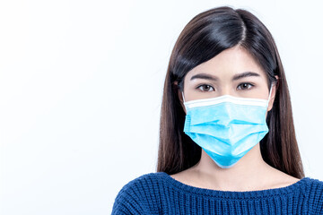 Portrait images of Asian woman wearing a surgical mask with white background, concept to health care and primary disease prevention, such as PM 2.5 and coronavirus or COVID-19