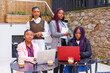 © unai - Young and alternative businesswomen of black ethnicity. In a teamwork meeting, in a cafeteria