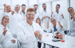 © ASDF - happy scientific supervisor and its working group in the workplace .