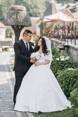 Wall Mural - Wedding in Florence, Italy, in an old villa-winery. Wedding couple in the garden at sunset.