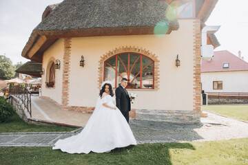 Wall Mural - Wedding in Florence, Italy, in an old villa-winery. Wedding couple in the garden at sunset.