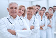 © ASDF - large group of medical colleagues standing in a row.