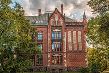 Building Built In Neo Gothic Style On A Cloudy Day. Rigas Academy Of Arts, Riga, Latvia