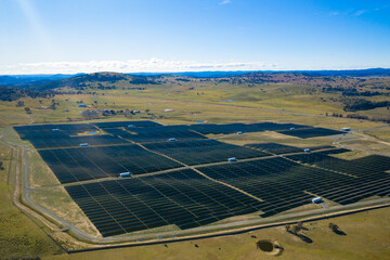 Wall Mural - aerial view above a large solar farm for renewable energy supply in canberra, australia