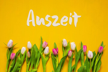 Wall Mural - German Text Auszeit Means Downtime. White And Pink Tulip Spring Flowers. Yellow Wooden Background