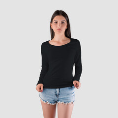 Long sleeve womens clothing mockup on caucasian girl in shorts, black sweatshirt isolated on background.