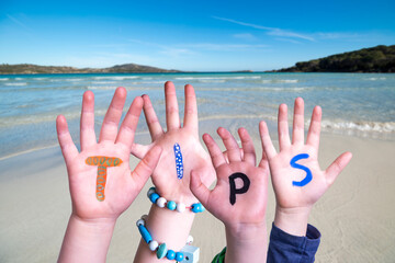 Wall Mural - Children Hands Building Colorful Word Tips. Ocean And Beach As Background