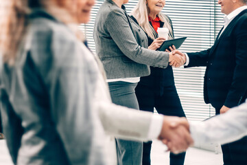 Poster - business people shaking hands in the Bank office