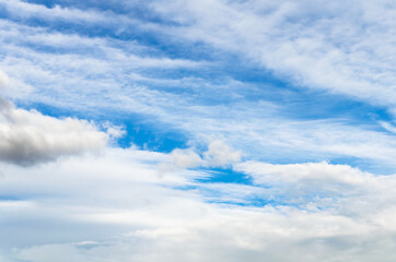 White clouds in a bright blue sky. The beauty of the nature