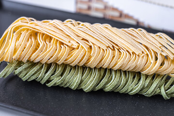 green and yellow healthy egg noodles close-up