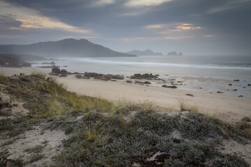 Poster - Mesmerizing shot of a beach under the cloudy sky near Cape Vilan in Camarinas, Galicia, Spain