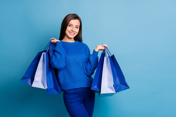 Wall Mural - photo of young happy positive good mood girl smiling hold shopping bags on black friday isolated on 
