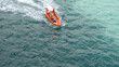 © Joe - sea rescue boat with man floating in water with life jacket drowning