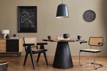 Modern composition of dining room interior with design wooden table, stylish chairs, decoration, teapot, cups, vessel, commode, black mock up poster map and elegant accessories in home decor. Template