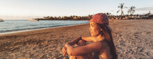 Asian Woman Relaxing On Beach Watching Sunset Alone Portrait Panoramic Banner.