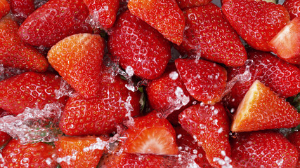Wall Mural - Top view of strawberries with water splashes