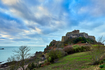 Wall Mural - Image of the East side of Gorey castle with the agricutural fiels and the sea. Jersey, Channel Islands