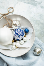 Christmas Baubles And Ornaments On Linen Cloth