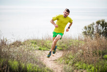 Runner Jogging On Cliff Top, Santa Barbara, California, USA