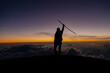© Fernanda - Silhouette woman climber at sunset on top of the Acatenango volcano in Guatemala-young woman reaching the goal of the excursion of her enjoying the last rays of sun on the volcano