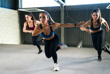 Beautiful Women Working Out During A HIIT Class