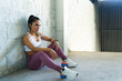 © AntonioDiaz - Hispanic woman taking a break from her workout