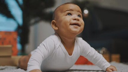 portrait of cute african american black baby having tummy time. high quality 4k footage