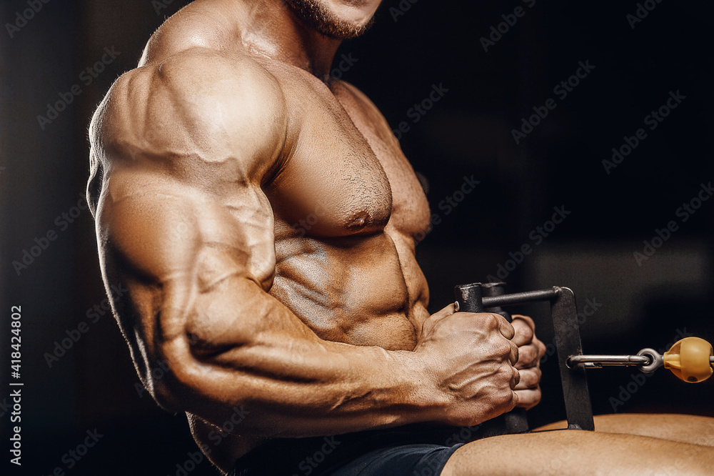 muscular bodybuilder fitness men doing arms exercises in gym - obrazy, fototapety, plakaty 