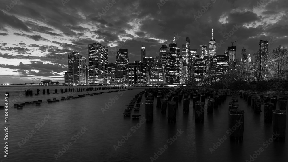 Beautiful black and white of New York City's Lower Manhattan skyline from Brooklyn.  - obrazy, fototapety, plakaty 