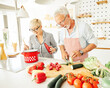 © Lumos sp - love kitchen senior woman man couple home retirement happy food smiling husband wife together person