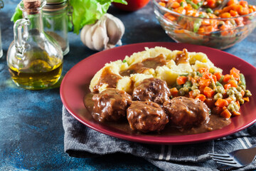 Canvas Print - Roasted meatballs in dark sauce with mashed potatoes