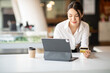 © David - Portrait of Young woman working with tablet and credit card at home , paying,payment,buying and online shopping concept.