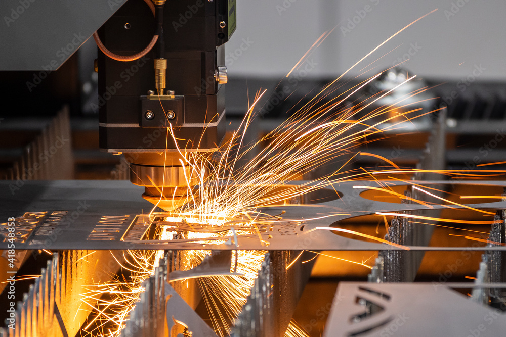 The fiber laser cutting machine cutting  machine cut the metal plate. The hi-technology sheet metal manufacturing process by laser cutting machine. - obrazy, fototapety, plakaty 