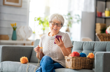 senior woman is using smartphone