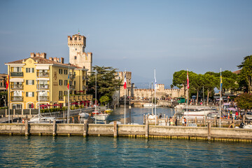 Wall Mural - Sirmione. View of the marina and the town on Lake Gardaa. Lombardy, Italy